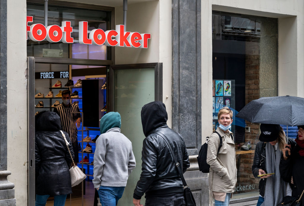 Shoppers walk inside the American multinational sportswear...