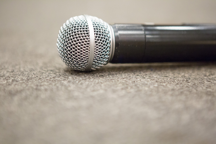 Selective focus of Microphone on stage floor background
