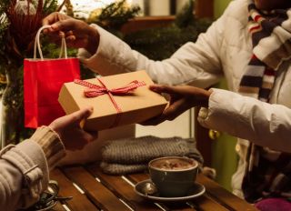 Women exchanging gifts with each other on Christmas
