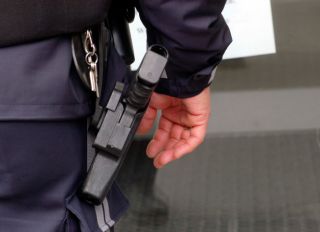 police officer with service weapon