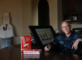 Scott Adams, cartoonist and author and creator of "Dilbert", poses for a portrait in his home office with his new book "How to Fail at Almost Everything and Still Win Big: Kind of the Story of My Life" on Monday, January 6, 2014 in Pleasanton, Calif.