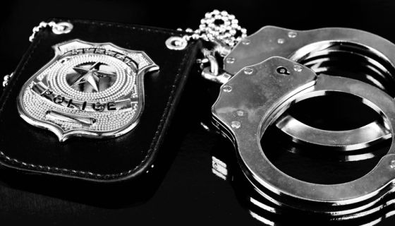 Badge and handcuffs for police duties