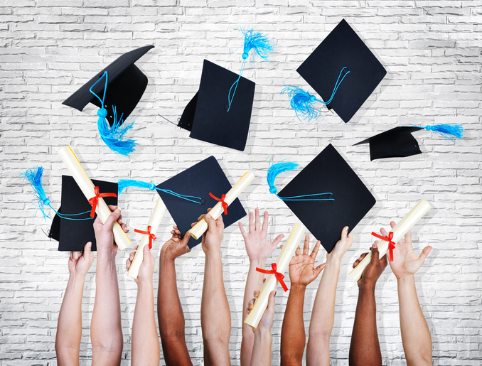Group of Hands Holding Diplomas and Throwing Graduation Hats
