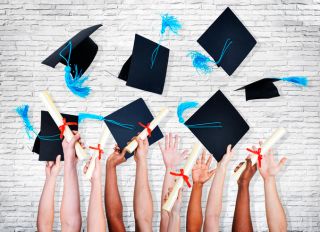 Group of Hands Holding Diplomas and Throwing Graduation Hats