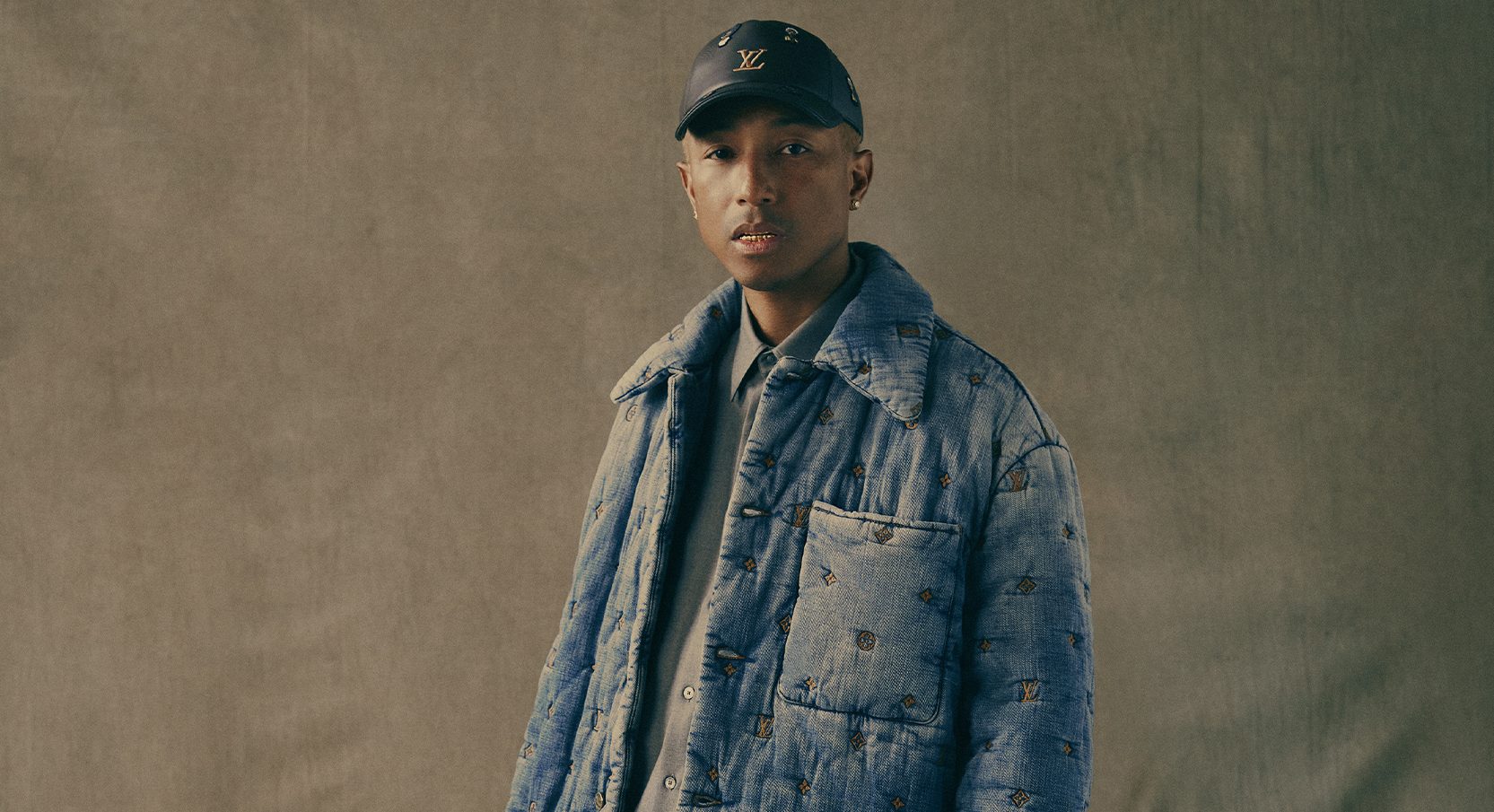 Travis Scott Wears Pharrell's Louis Vuitton With Air Jordan 1s