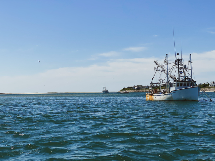 traditional fishing boat moored off coast of cape cod