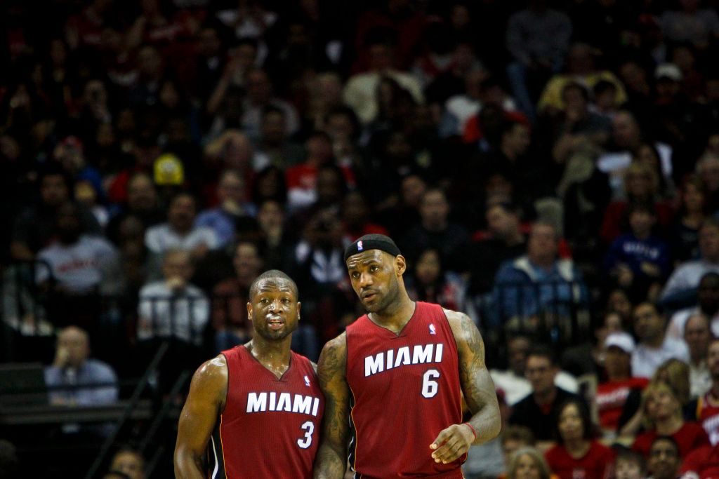 Dwyane Wade & Lebron James w/ 2012 NBA Champs Trophies