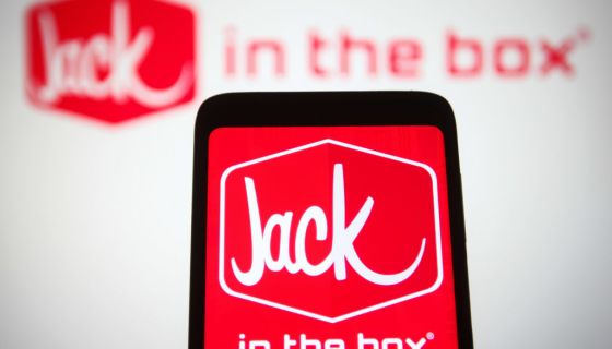 In this photo illustration, the Jack in the Box Inc. logo, a...