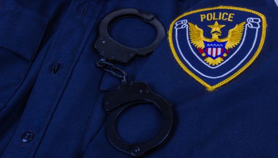 Law Enforcement Uniform With Generic Police Patch And Handcuffs
