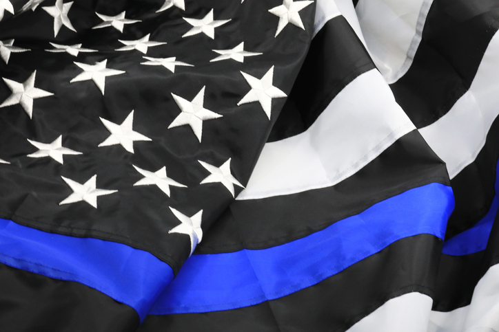American flag colored in Police Lives Matter colors