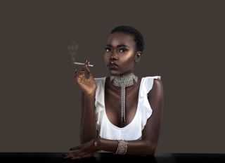 Joint Smoking Stylish Black Lady in Silver Jewelry