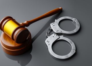 Sentencing concept for crime with handcuffs and judgment baton,3d rendering
