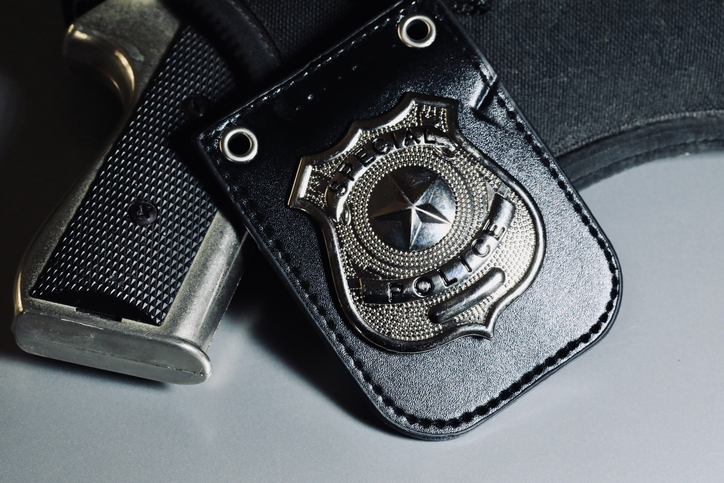 Badge and service weapon for police