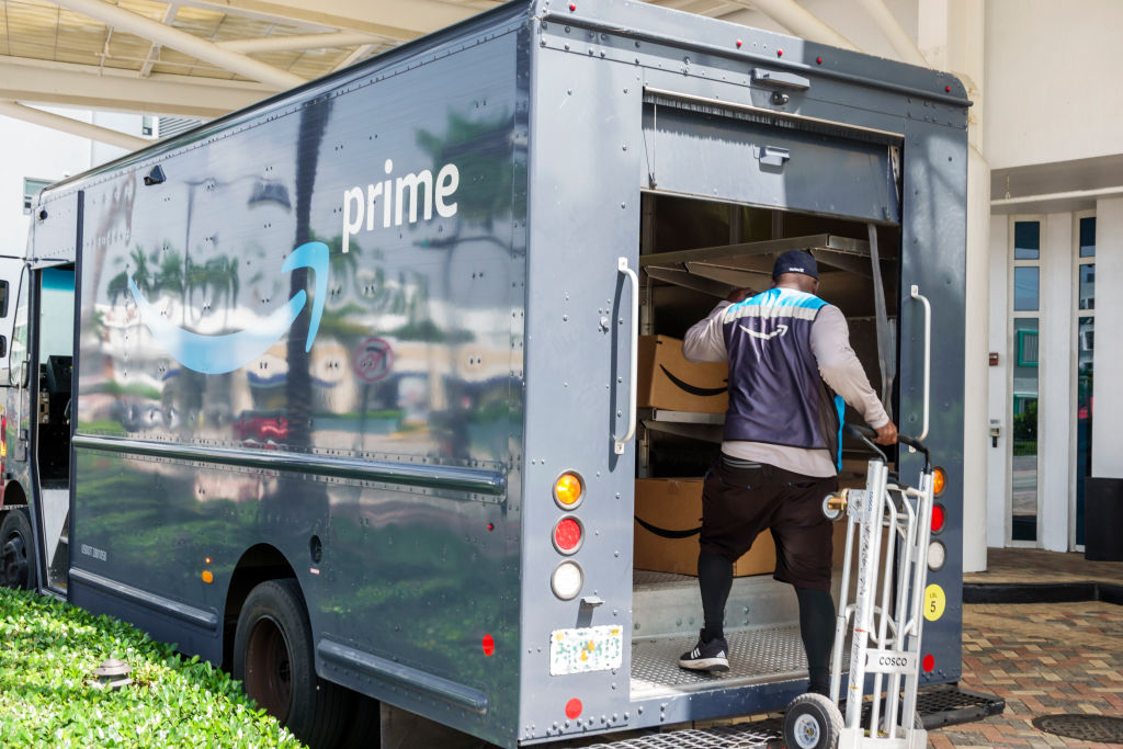 Miami Beach, Florida, Amazon Prime delivery van with driver holding hand truck