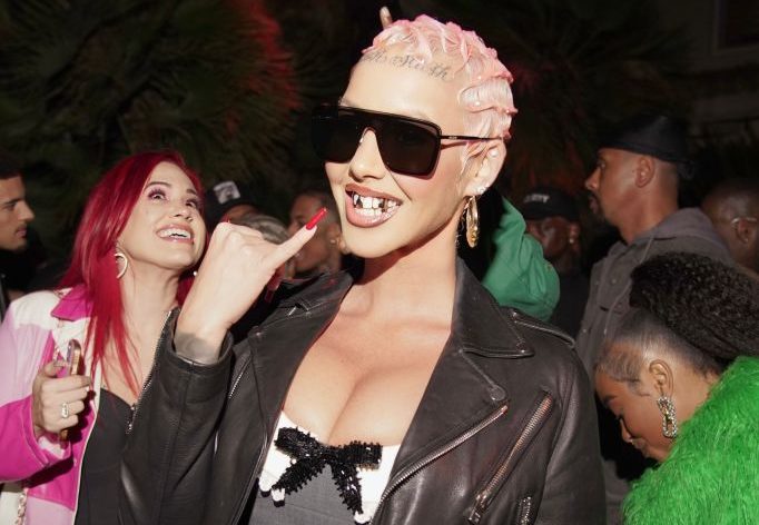 Incomparable Clownery: Disappointing Dorito Endorser Amber Rose Adorns Herself In Donald Trump-Themed Jewelry