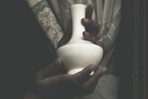 holding a urn