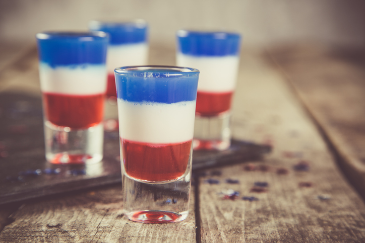 Independence day concept - flag coloured short cocktails on rustic background