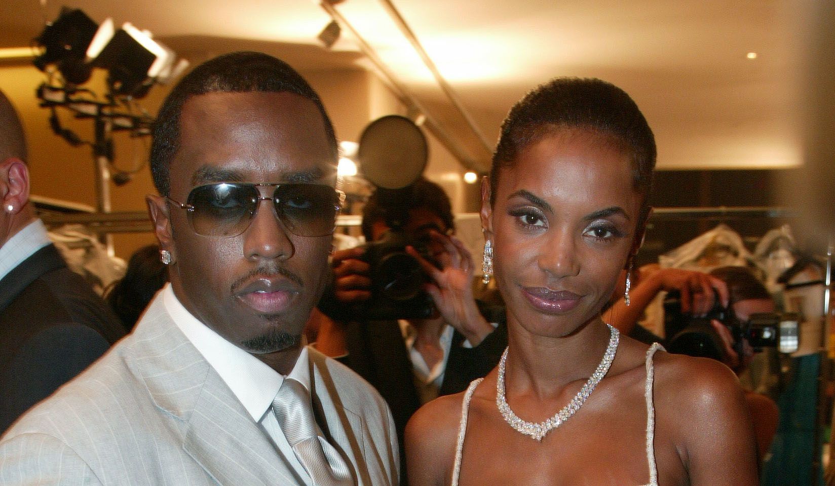 Sean "Diddy" Combs and Kim Porter attend Haute Couture Fall-winter Versace 2002/03