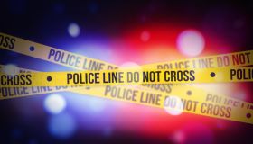 Glowing bokeh Police lights blur with Yellow tape showing typography do not cross, alert concept background. Police, legal, inquiry, warning concept