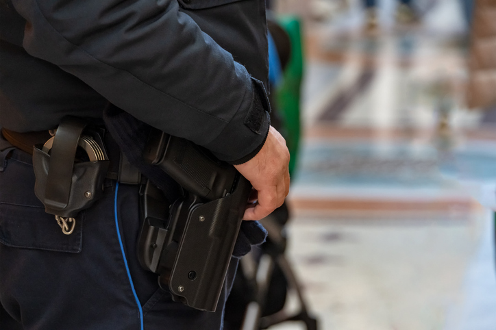 Police officer carrying weapons