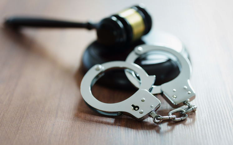 Judge’s Gavel and Handcuffs – Symbol of Justice and Punishment