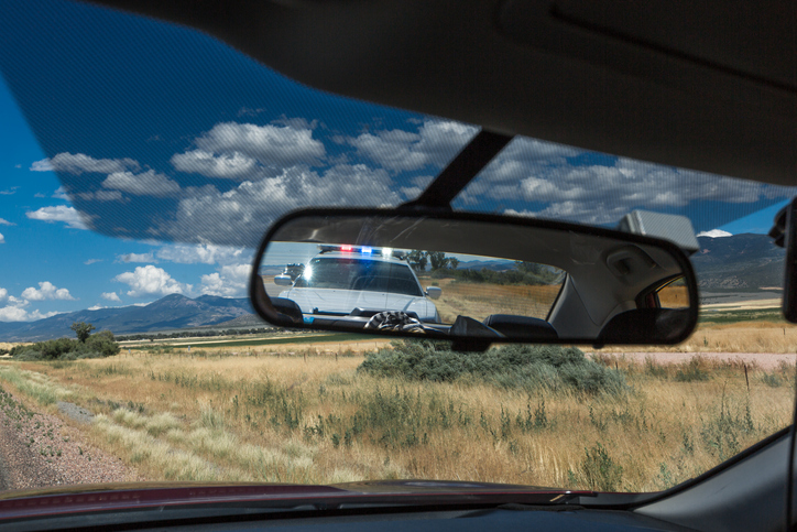 Police pulling over vehicle on the streets