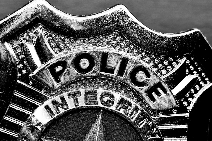 Police badge partial view