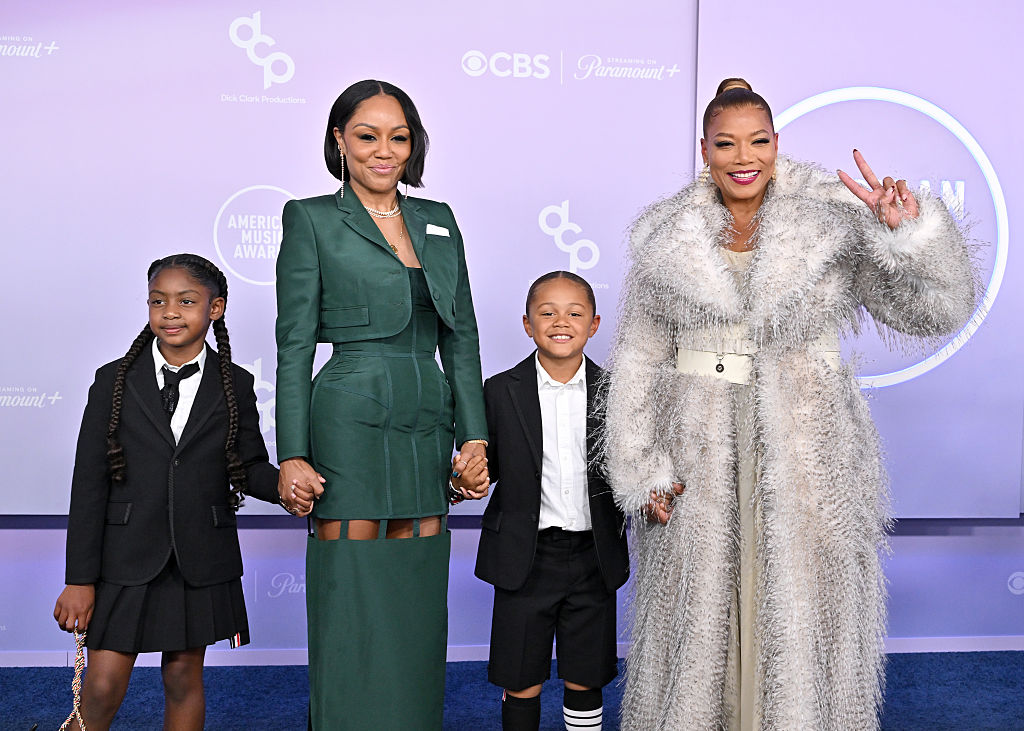 A Family Affair! Queen Latifah Makes Rare Appearance With Partner Eboni Nichols And Their Son Rebel On AMAs Carpet