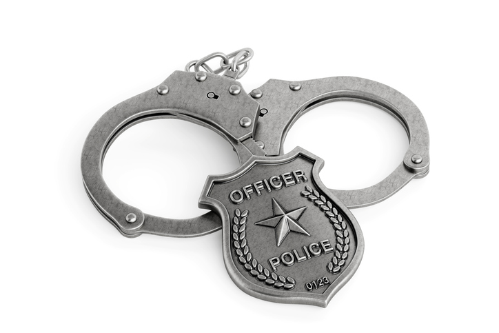 Law Enforcement Concept. Metal Handcuffs With Police Badge. 3D Rendering