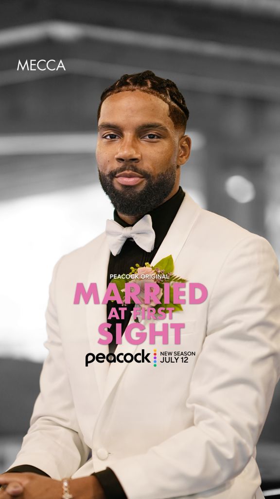 A man wearing a white suit and bow tie stands in front of a "Married at First Sight" logo on a Peacock TV backdrop.