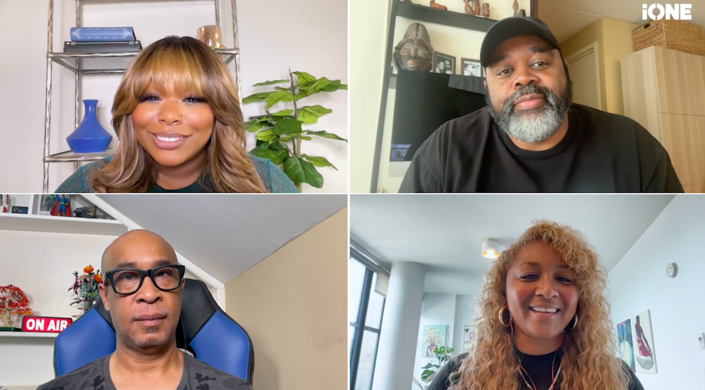 Four people in a video call, including a woman with blonde hair and a man with a beard, discussing something on their screens.