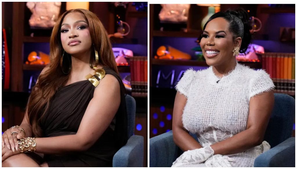 Two women, one wearing a black dress and the other a white fuzzy top, sitting on a couch in a studio setting with colorful lighting.
