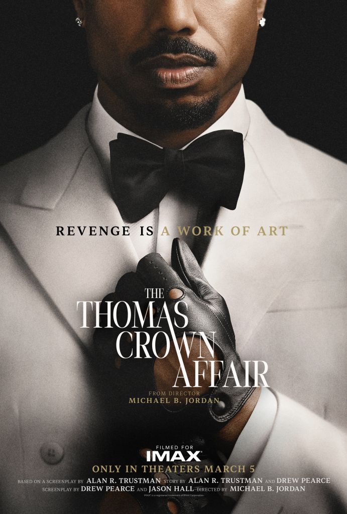 A well-dressed man with a beard and mustache wearing a tuxedo and bow tie. The text on the image reads "REVENGE IS A WORK OF ART" and "THE THOMAS CROWN AFFAIR".