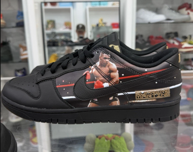 Black sneakers with Supreme Martine graphic and Nike logo