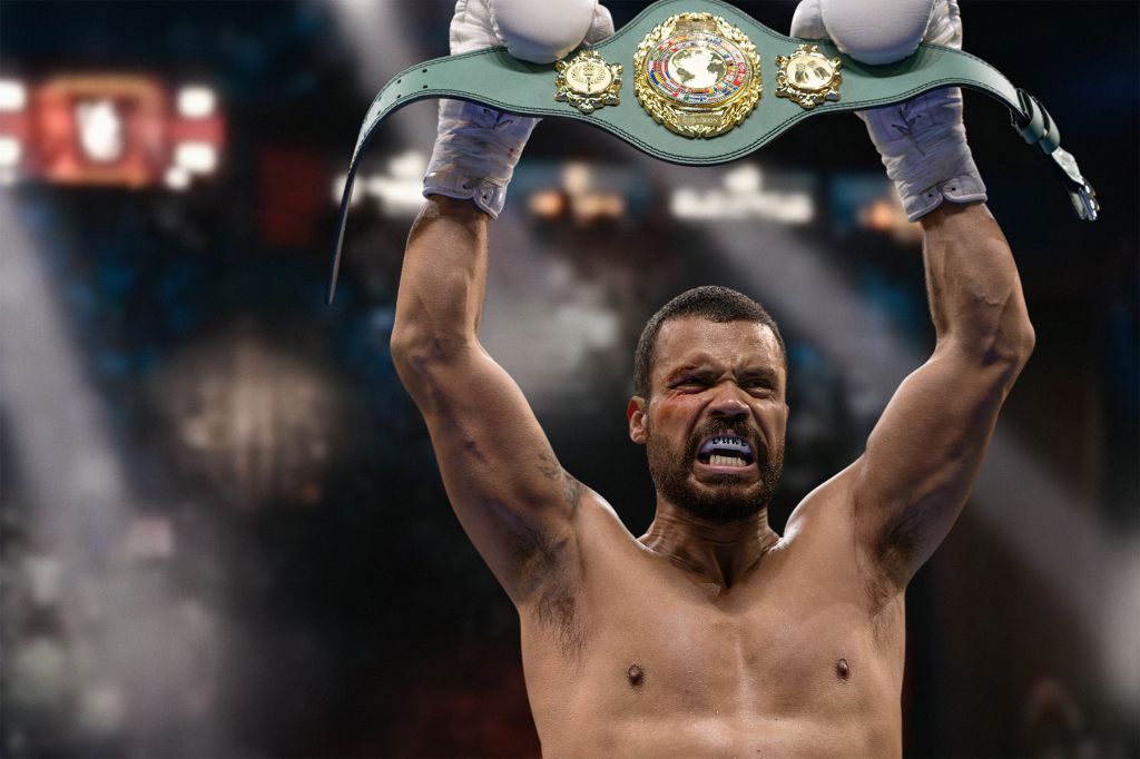 A muscular man raising his arms and holding a championship belt, with a determined expression on his face.