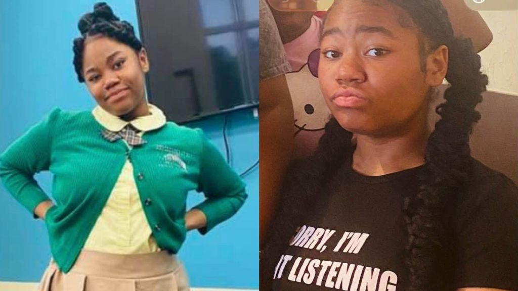 A young woman wearing a green jacket and a woman wearing a black t-shirt that says "Sorry, I'm not listening