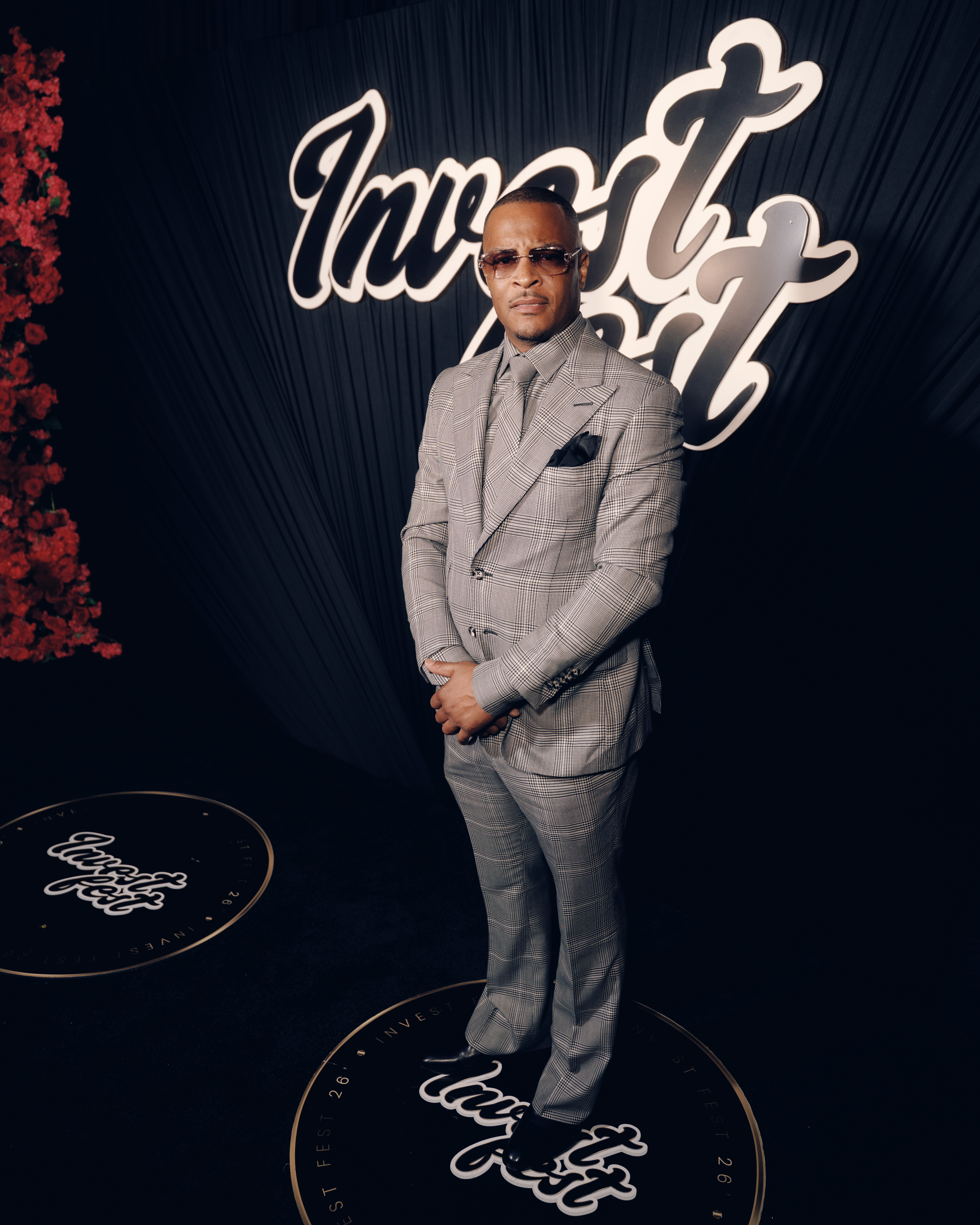 A man in a gray checked suit stands in front of a large "Impact" sign, with a "Ciroc" logo on the floor.