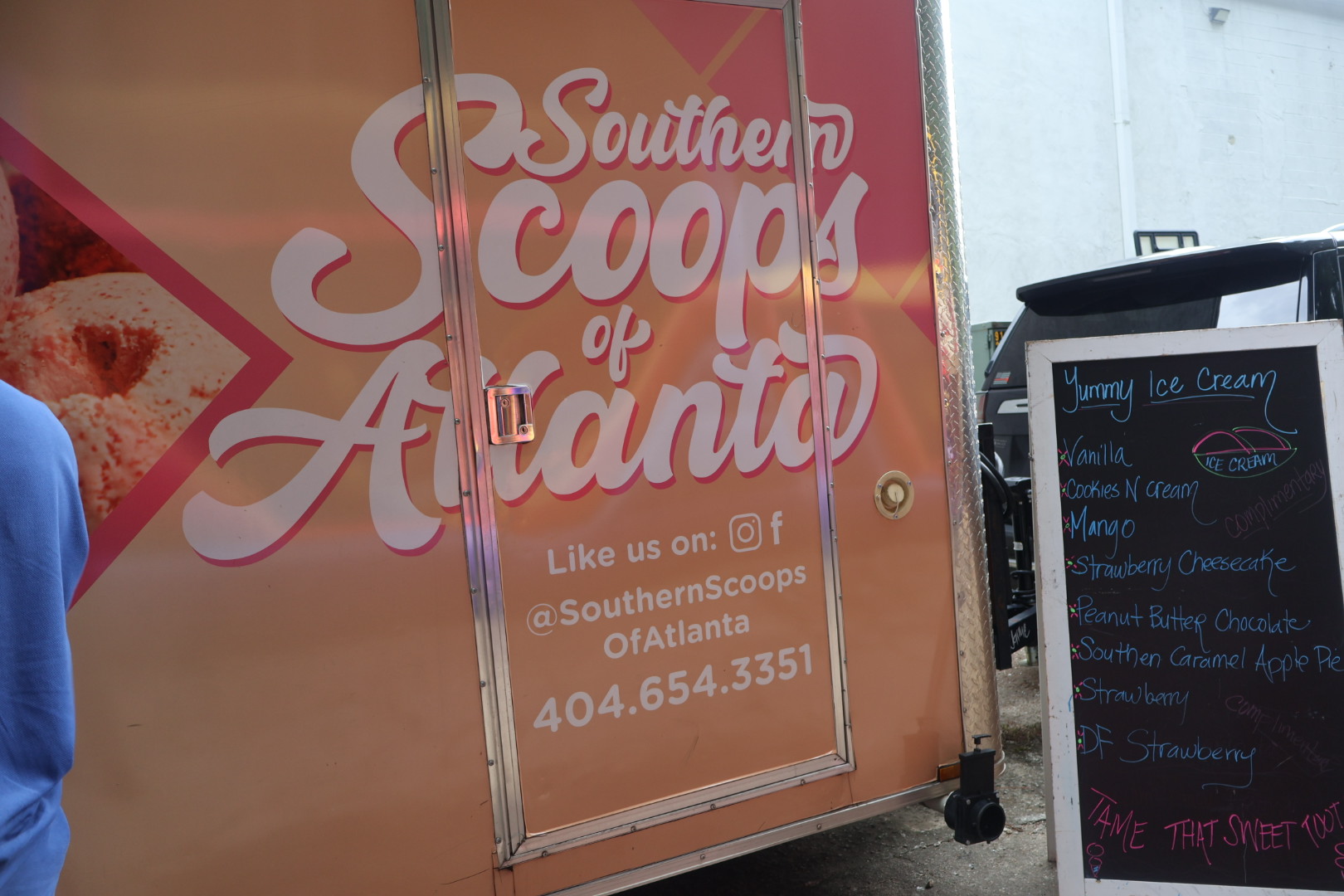Southern Scoops of Atlanta ice cream shop storefront with logo and menu board displaying flavors.