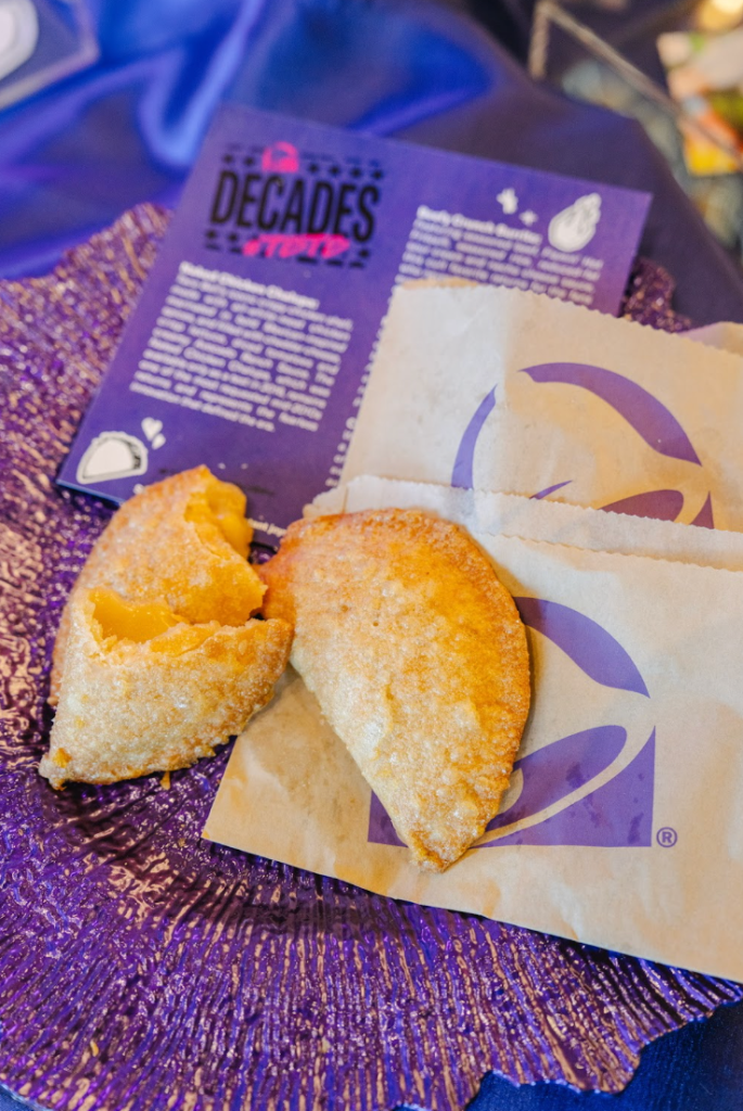 Two fried chicken patties on a purple Decades brand food wrapper.