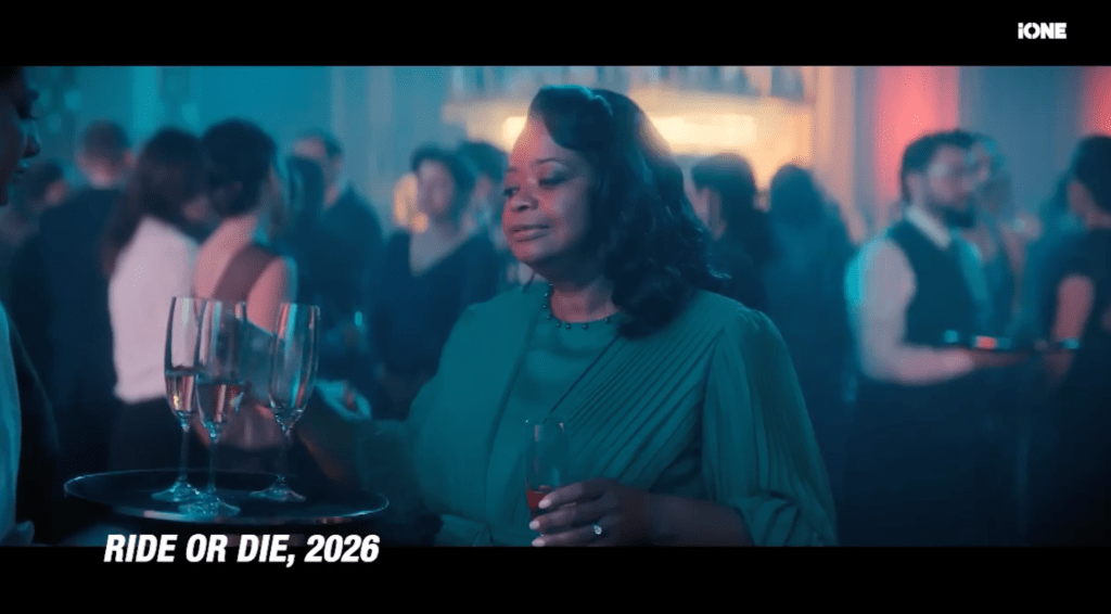 A woman holding a glass of wine in a crowded party setting, with the text "RIDE OR DIE, 2026" displayed.