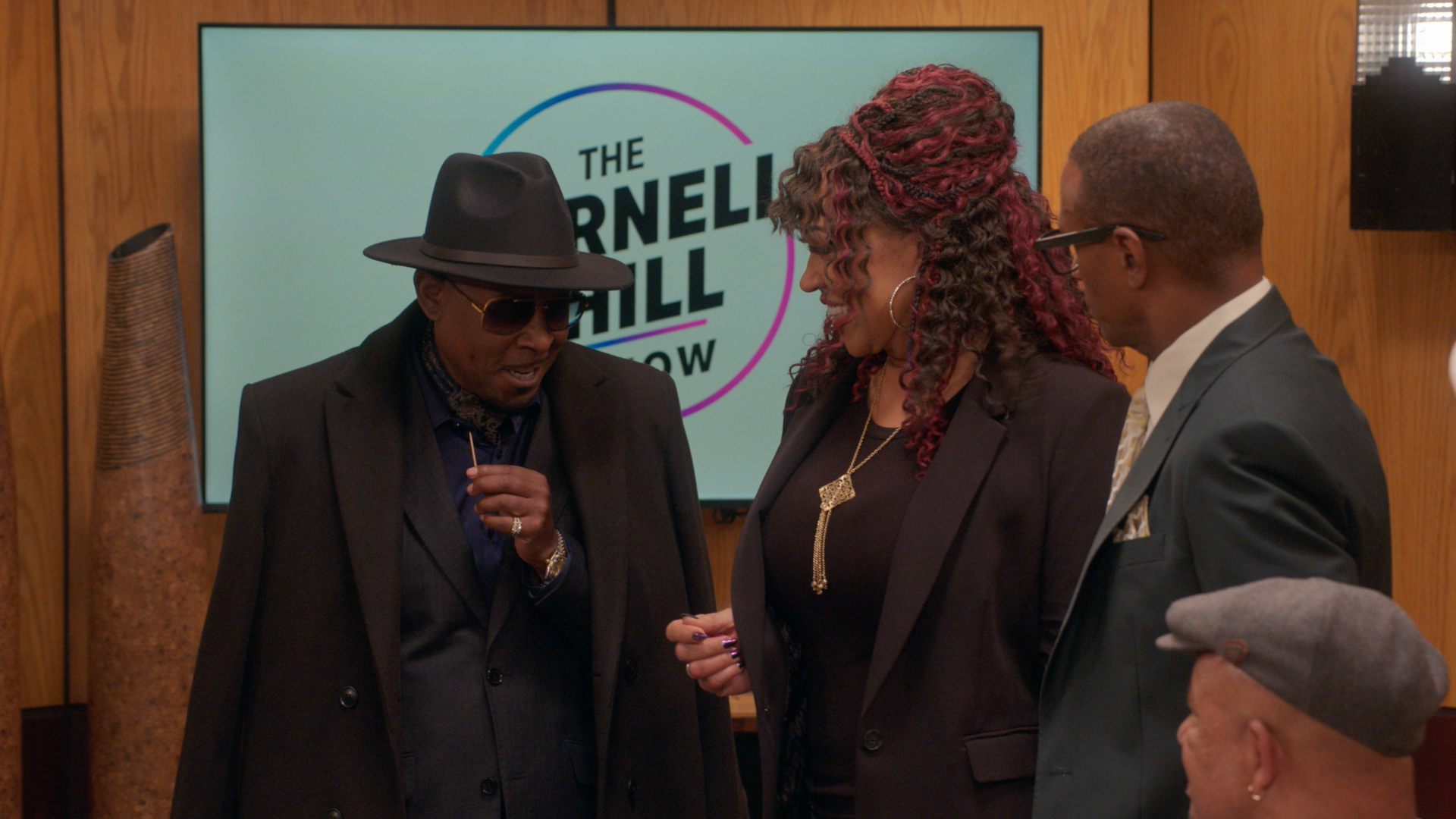 Three people standing in front of a backdrop with "The Varnell Hill Show" logo.